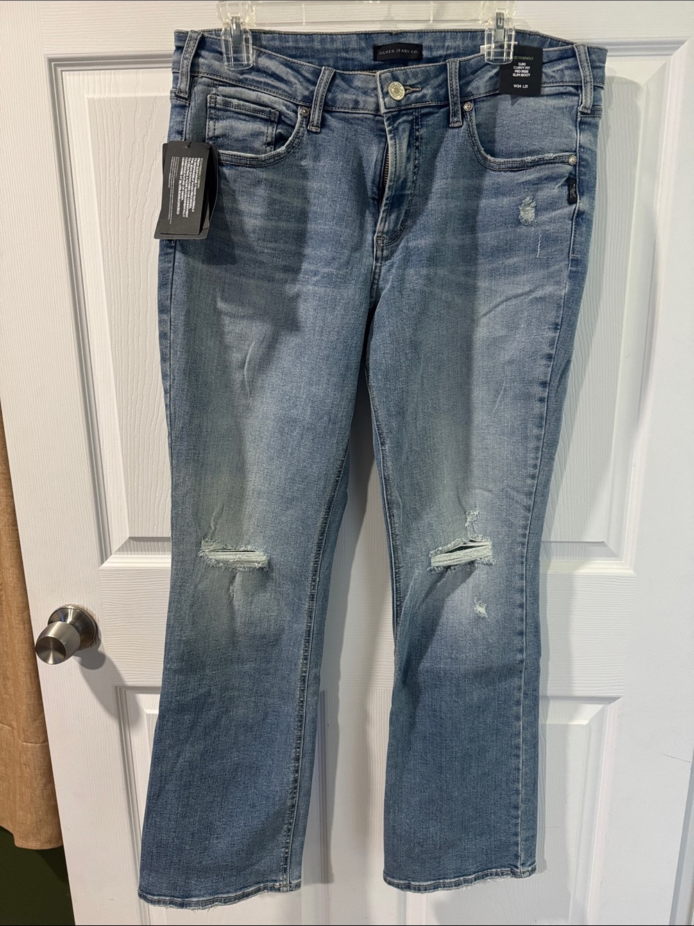 Silver Jeans Light Blue Boot Cut Jeans with Knee Distress